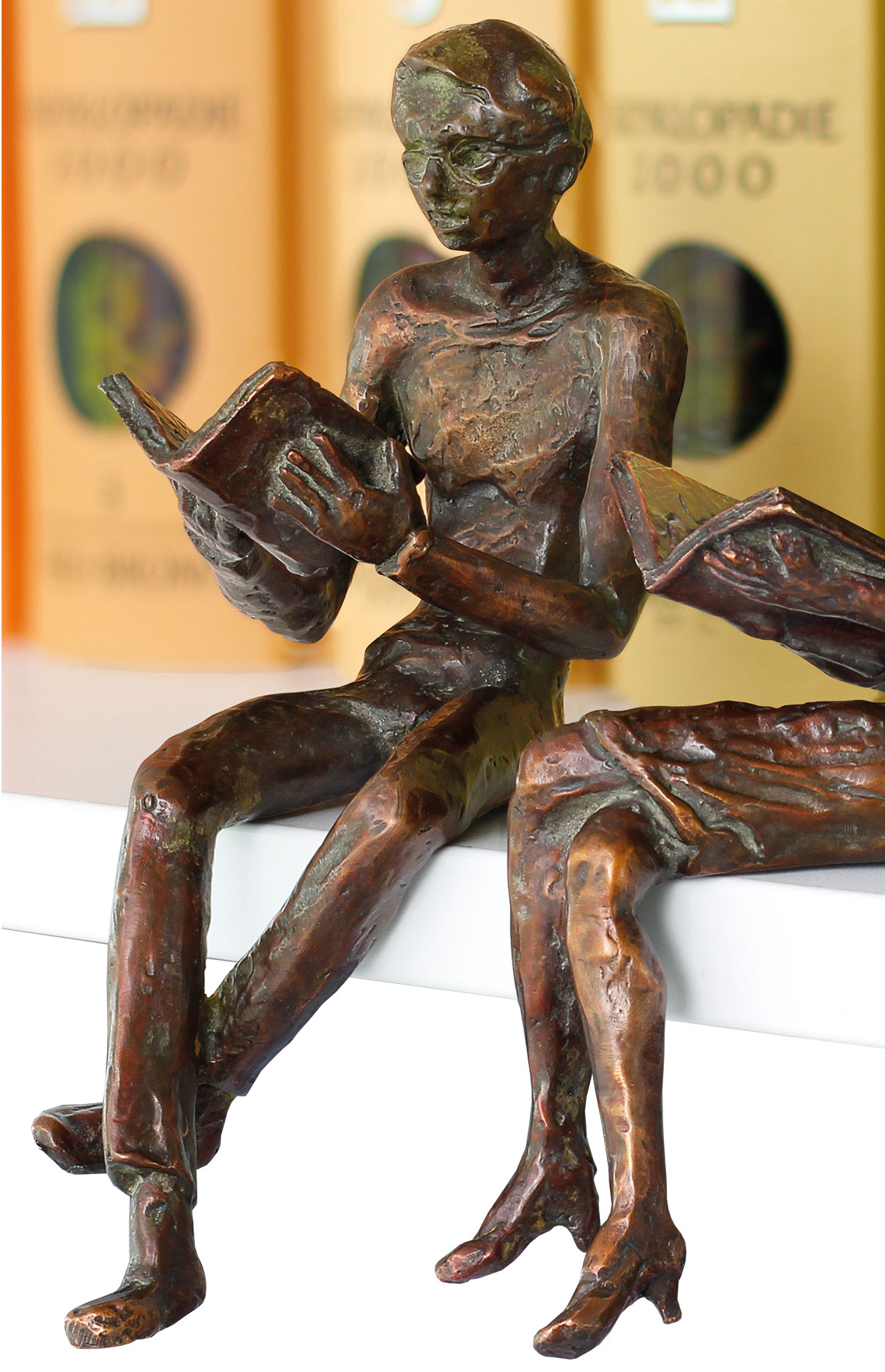 Sculpture / shelf sitter "Reading Man", metal casting by Birgit Stauch