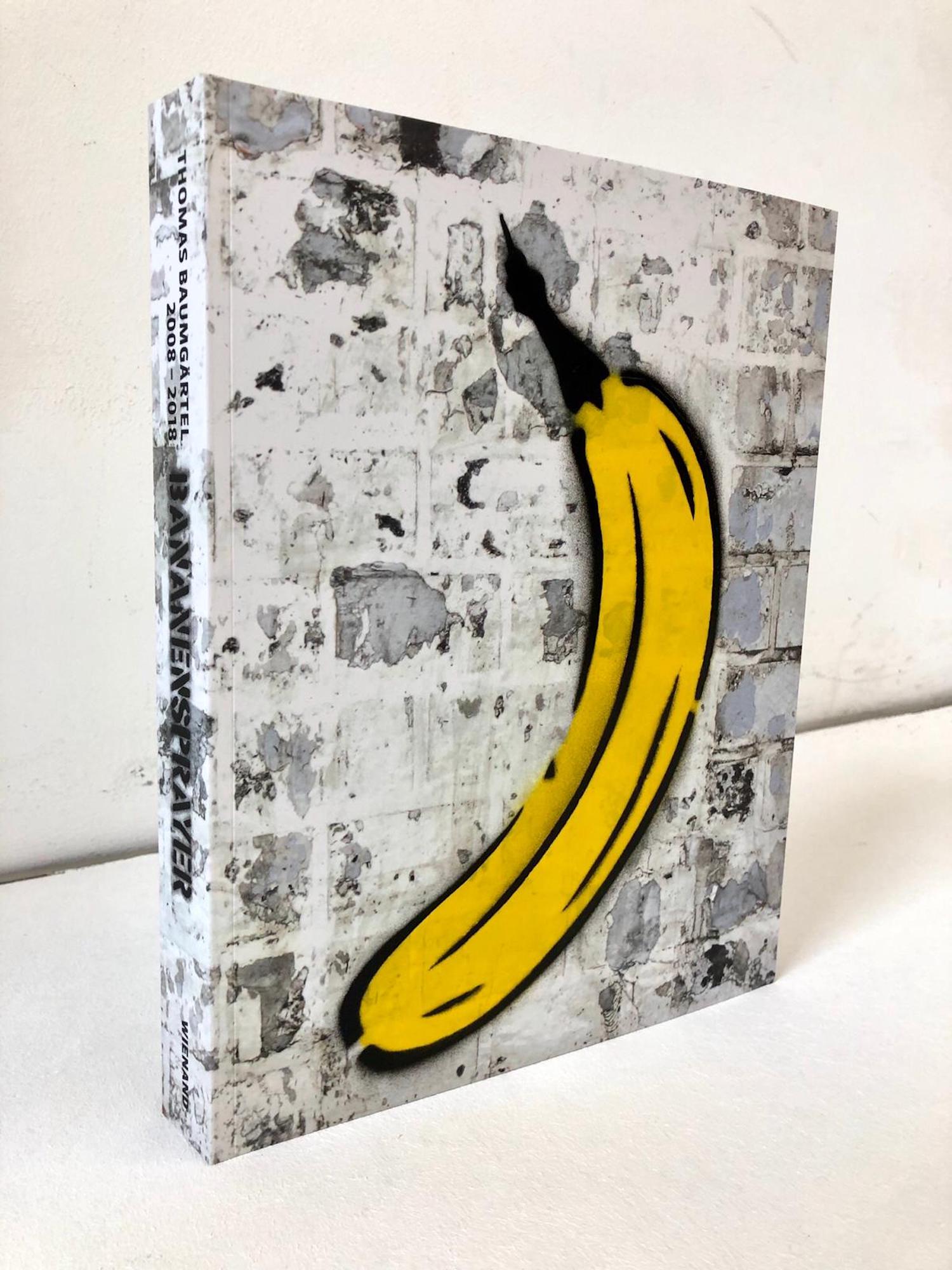 Thomas Baumgärtel: Objekt ‚Buch mit handgesprayter Banane‘ (2019)