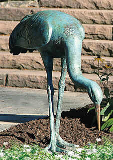 Garden sculpture "Crane, eating", bronze
