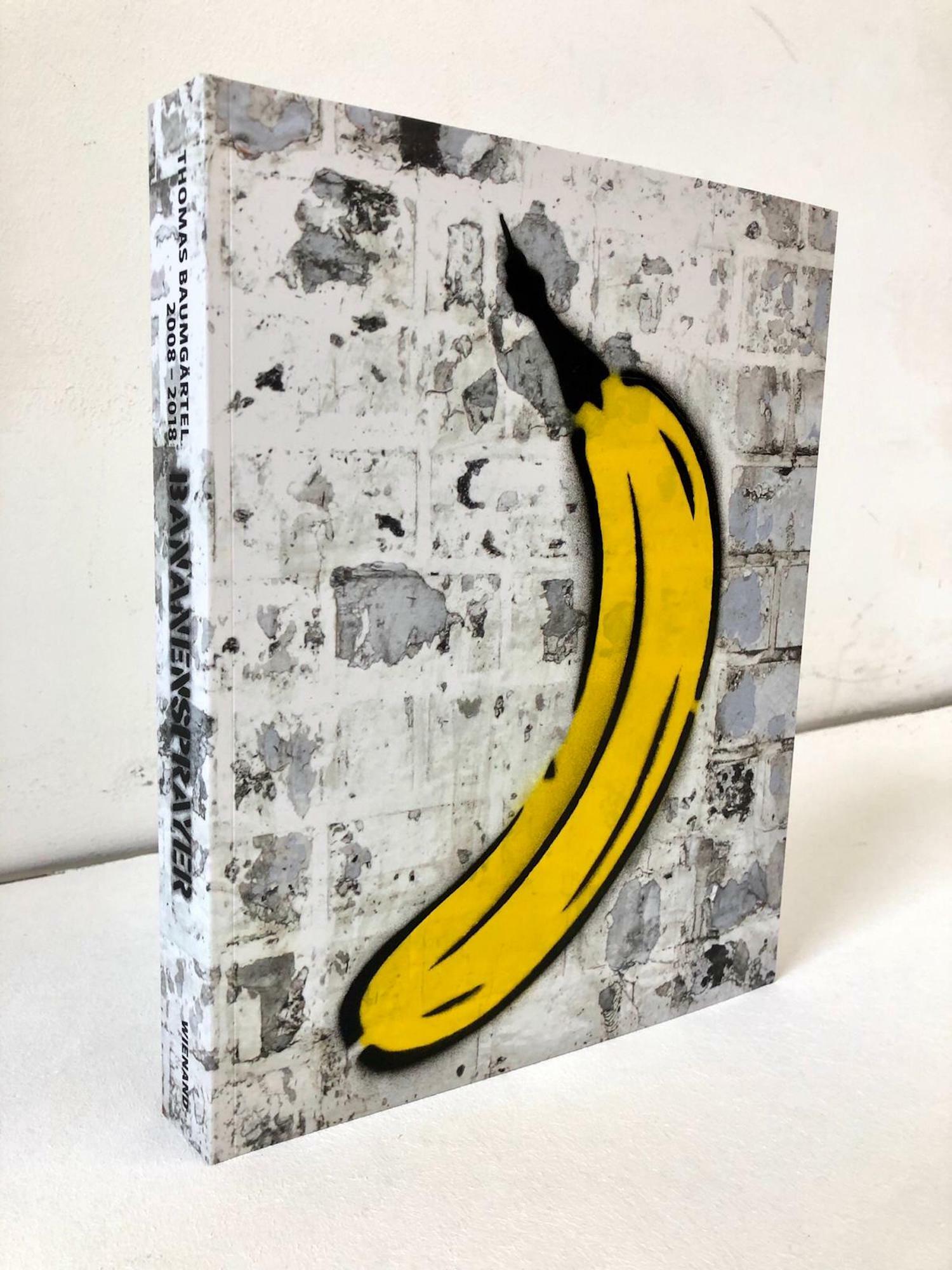 Object "Boek met handgespoten banaan" (2019) von Thomas Baumgärtel