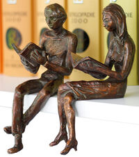 Coppia di sculture / mensole "Reading Woman & Reading Man", fusione di metallo